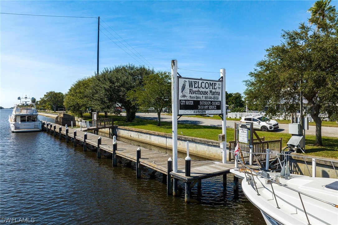 300 1st Street Moore Haven, FL 33471 - Photo 4 of 45 a view of a swimming pool with outdoor seating