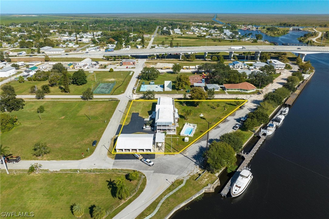 300 1st Street Moore Haven, FL 33471 - Photo 43 of 45 an aerial view of a pool with a yard