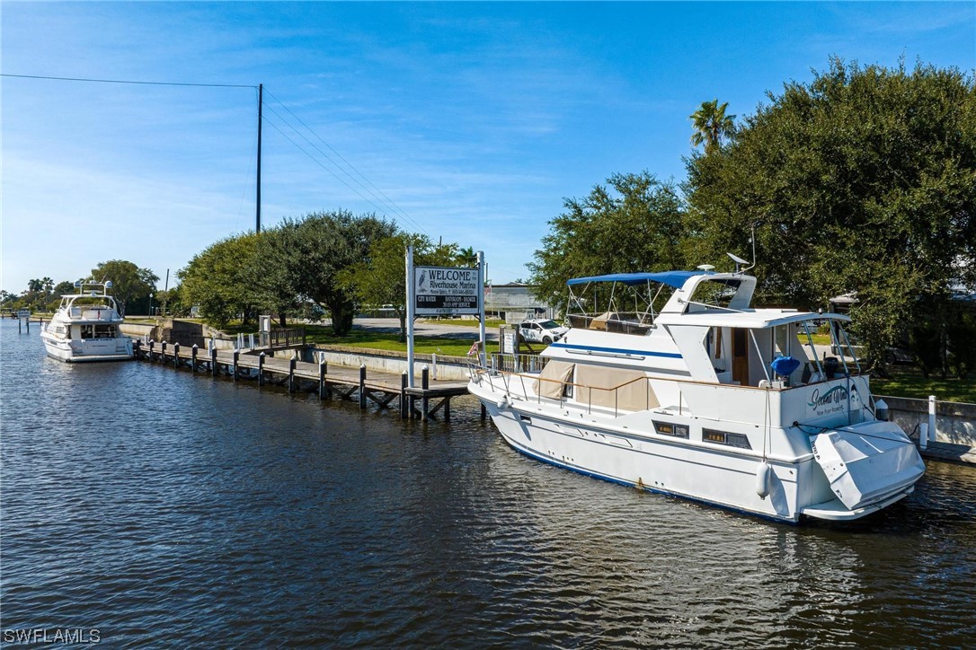 300 1st Street Moore Haven, FL 33471 - Photo 45 of 45 a white house sitting next to a lake