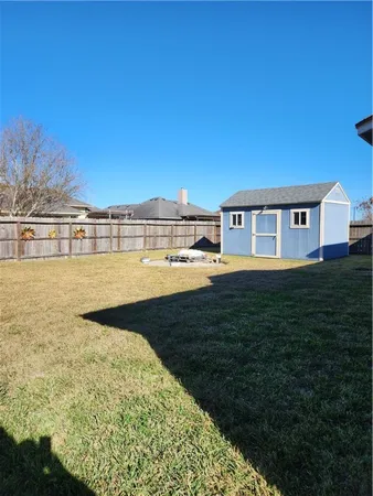 a view of a lake with a big yard
