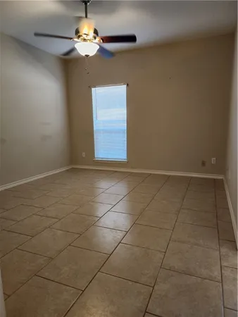 a view of a livingroom with a chandelier fan