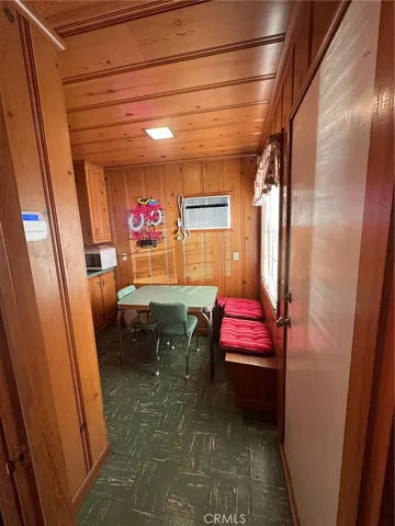 a hallway with furniture and a window