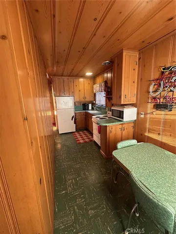a kitchen with lots of counter top space and wooden floor