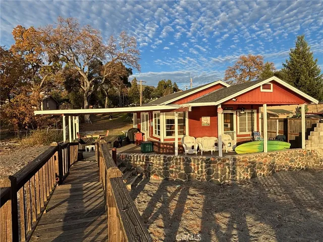 a view of a house with pool sitting chairs