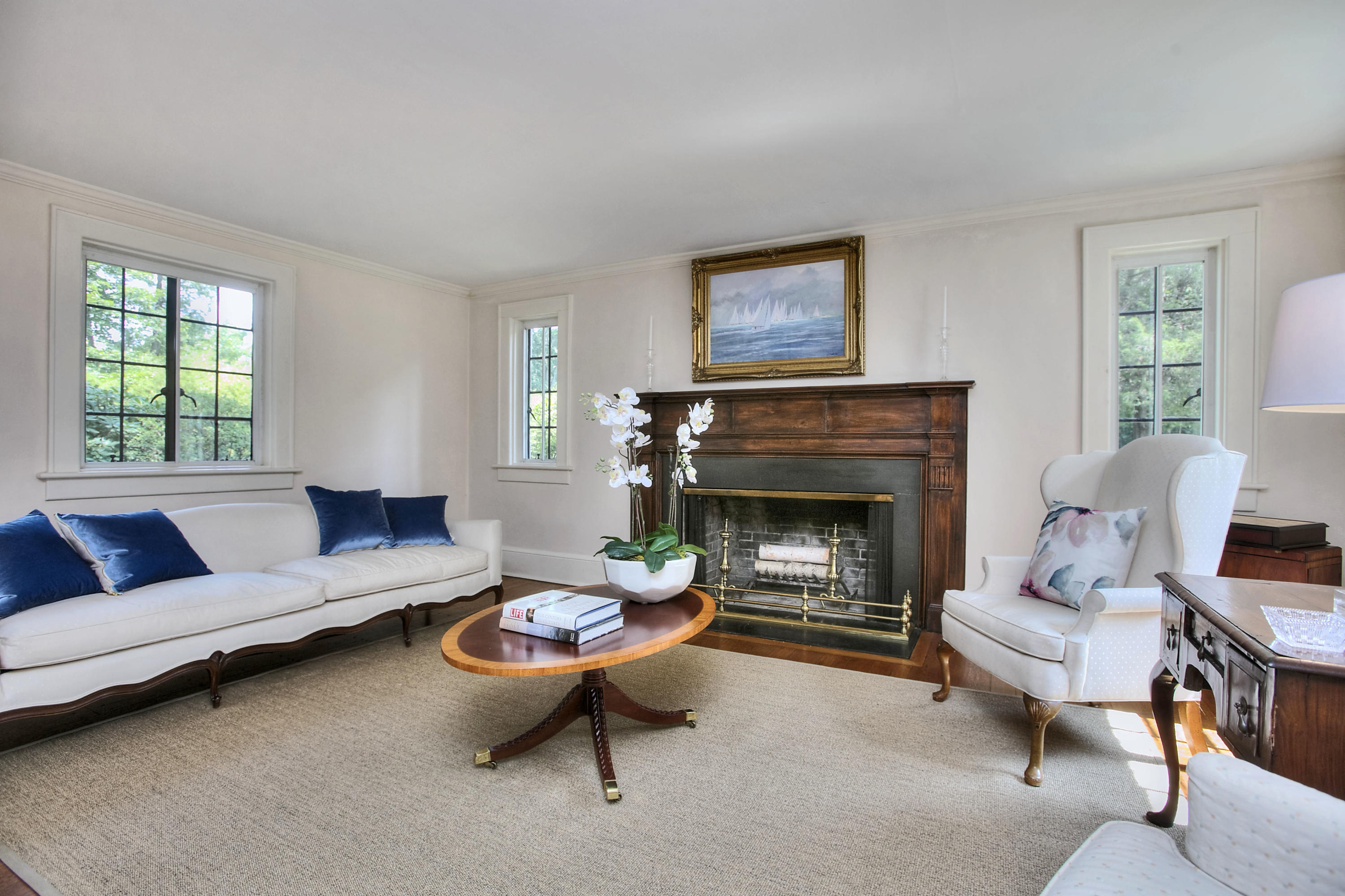 9 Sunswyck Road Darien, CT 06820 - Photo 12 of 43 a living room with furniture and a fireplace