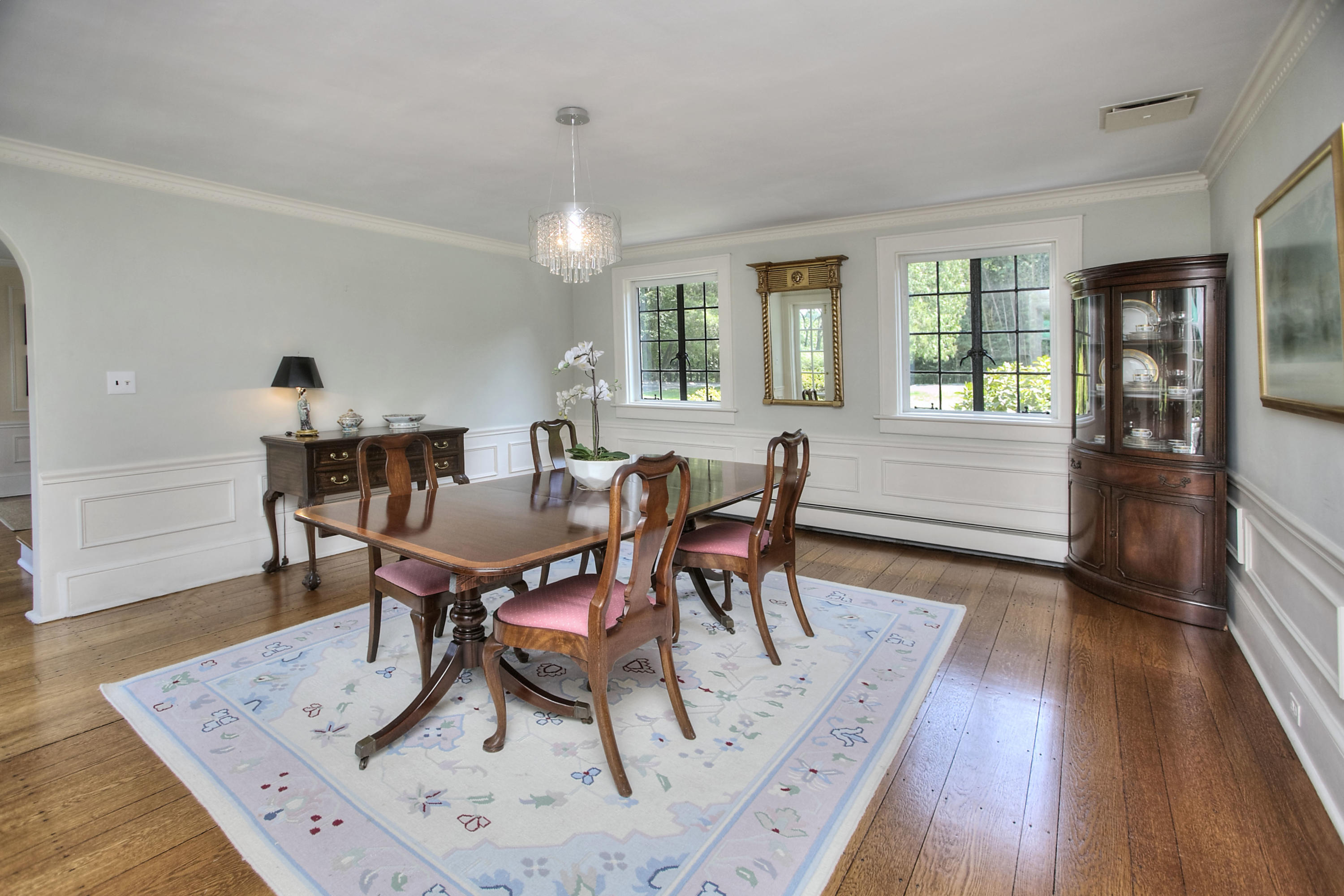 9 Sunswyck Road Darien, CT 06820 - Photo 14 of 43 a view of a dining room with furniture and wooden floor