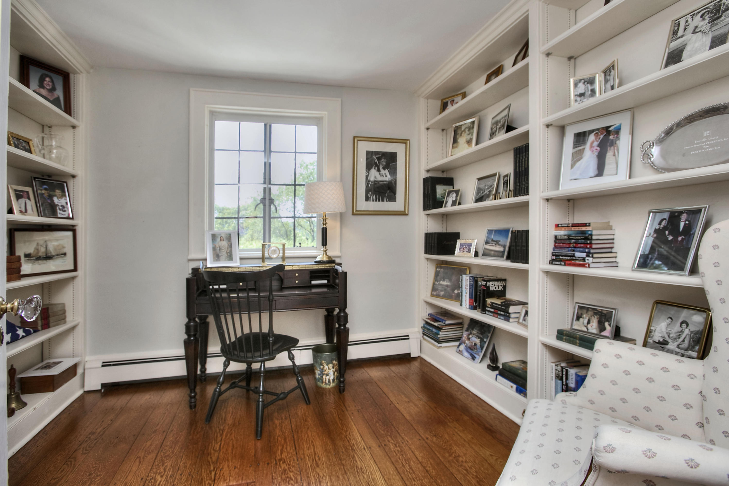 9 Sunswyck Road Darien, CT 06820 - Photo 15 of 43 a view of a workspace with furniture and a bookshelf