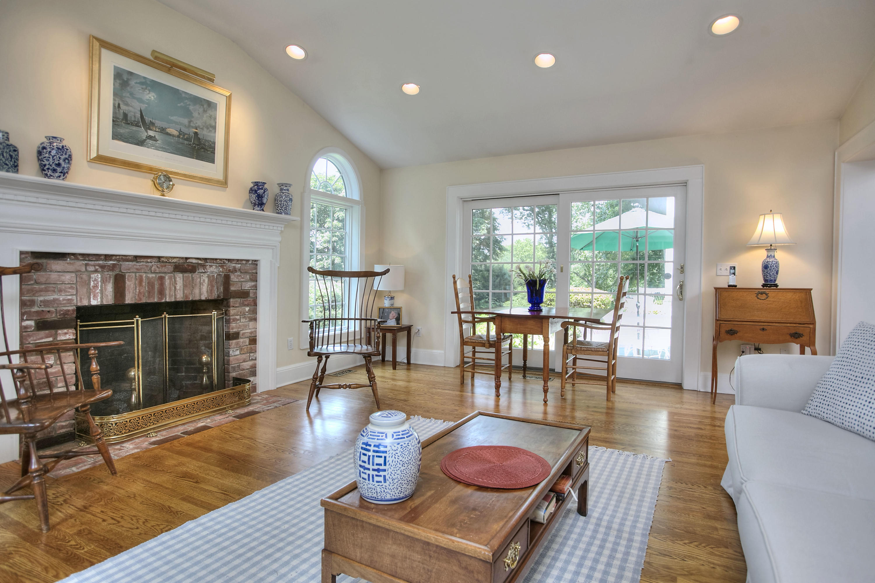 9 Sunswyck Road Darien, CT 06820 - Photo 20 of 43 a living room with furniture a window and a fireplace