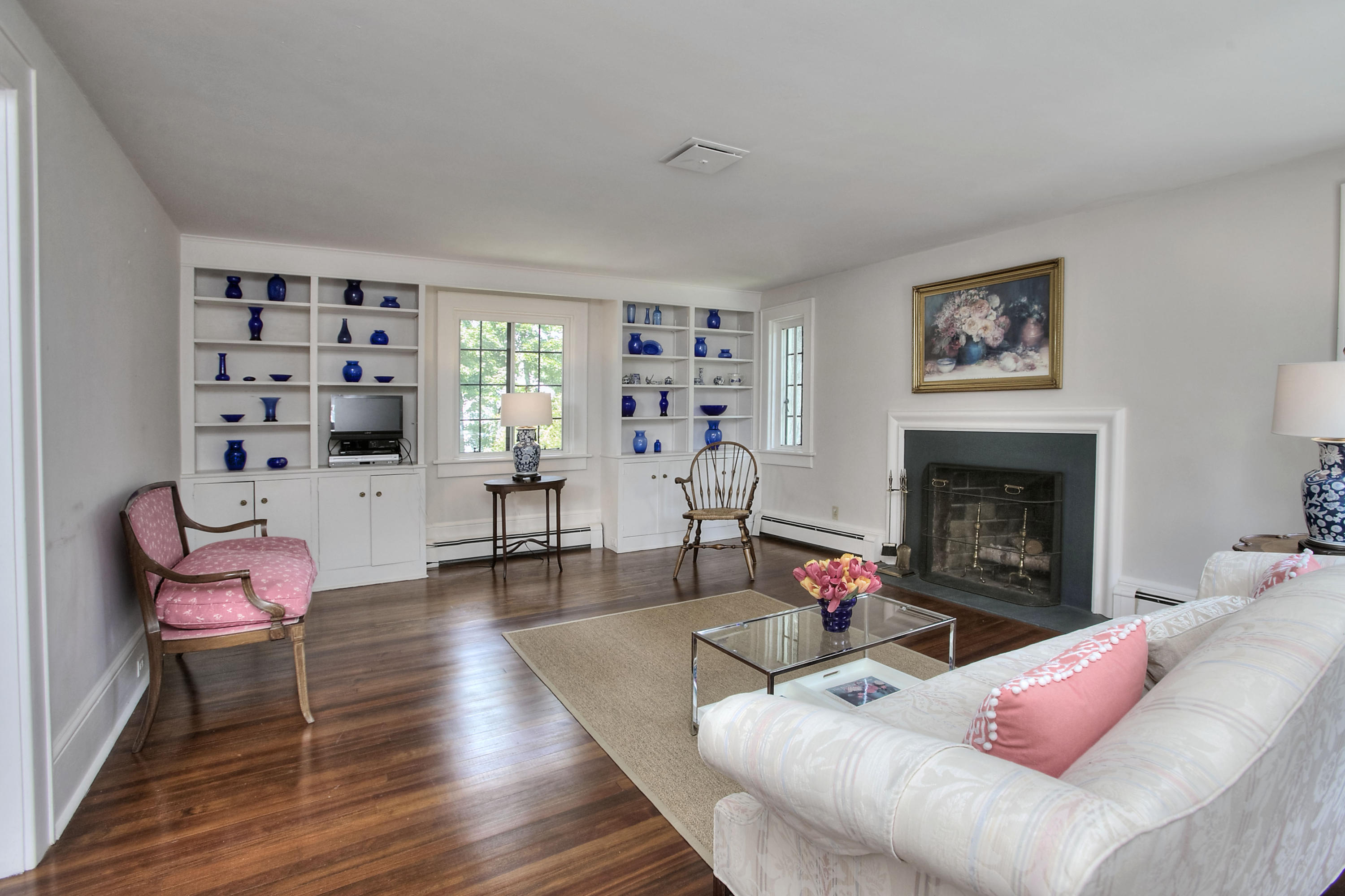 9 Sunswyck Road Darien, CT 06820 - Photo 23 of 43 a living room with furniture a window and a fireplace