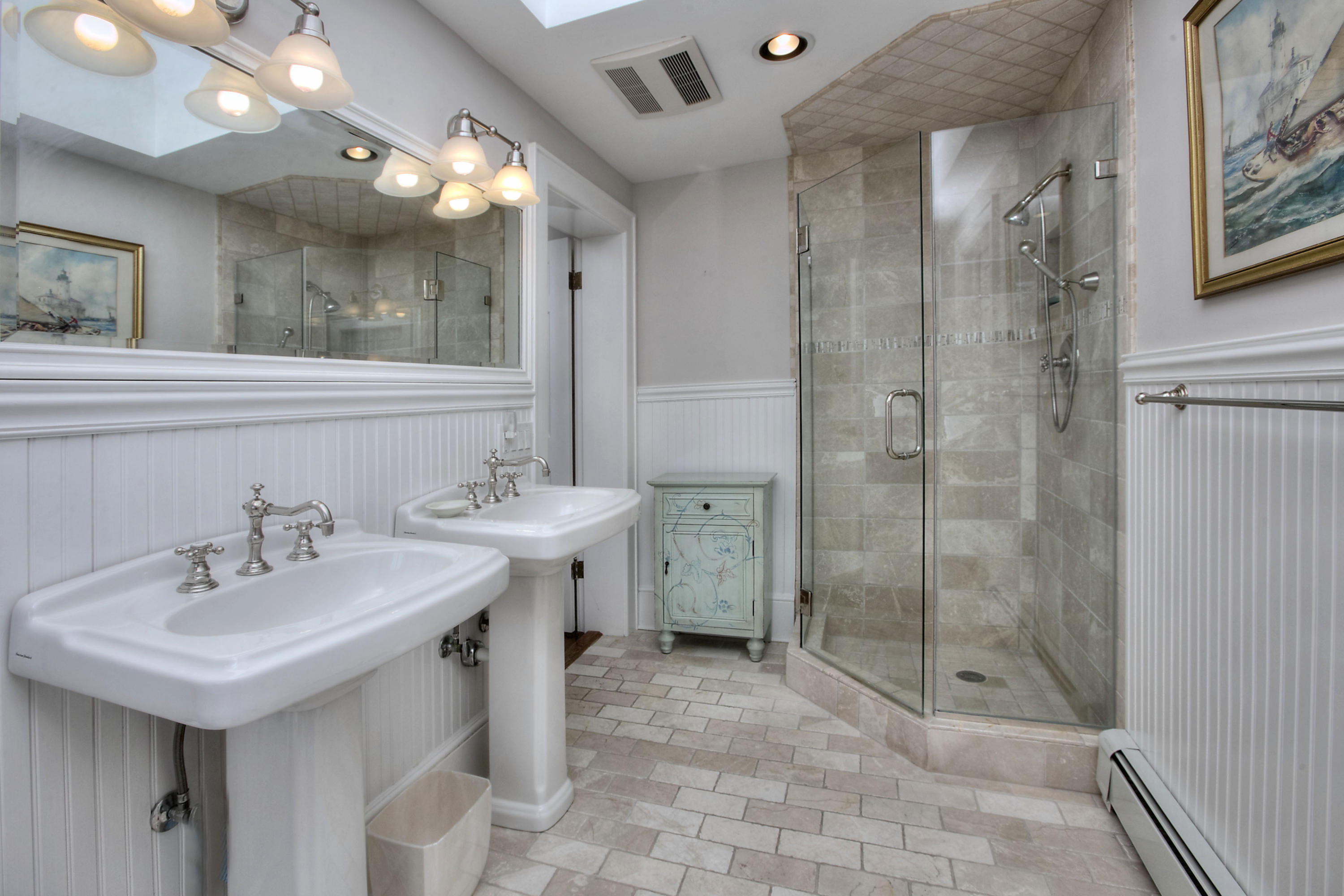 9 Sunswyck Road Darien, CT 06820 - Photo 28 of 43 a bathroom with a shower sink and mirror