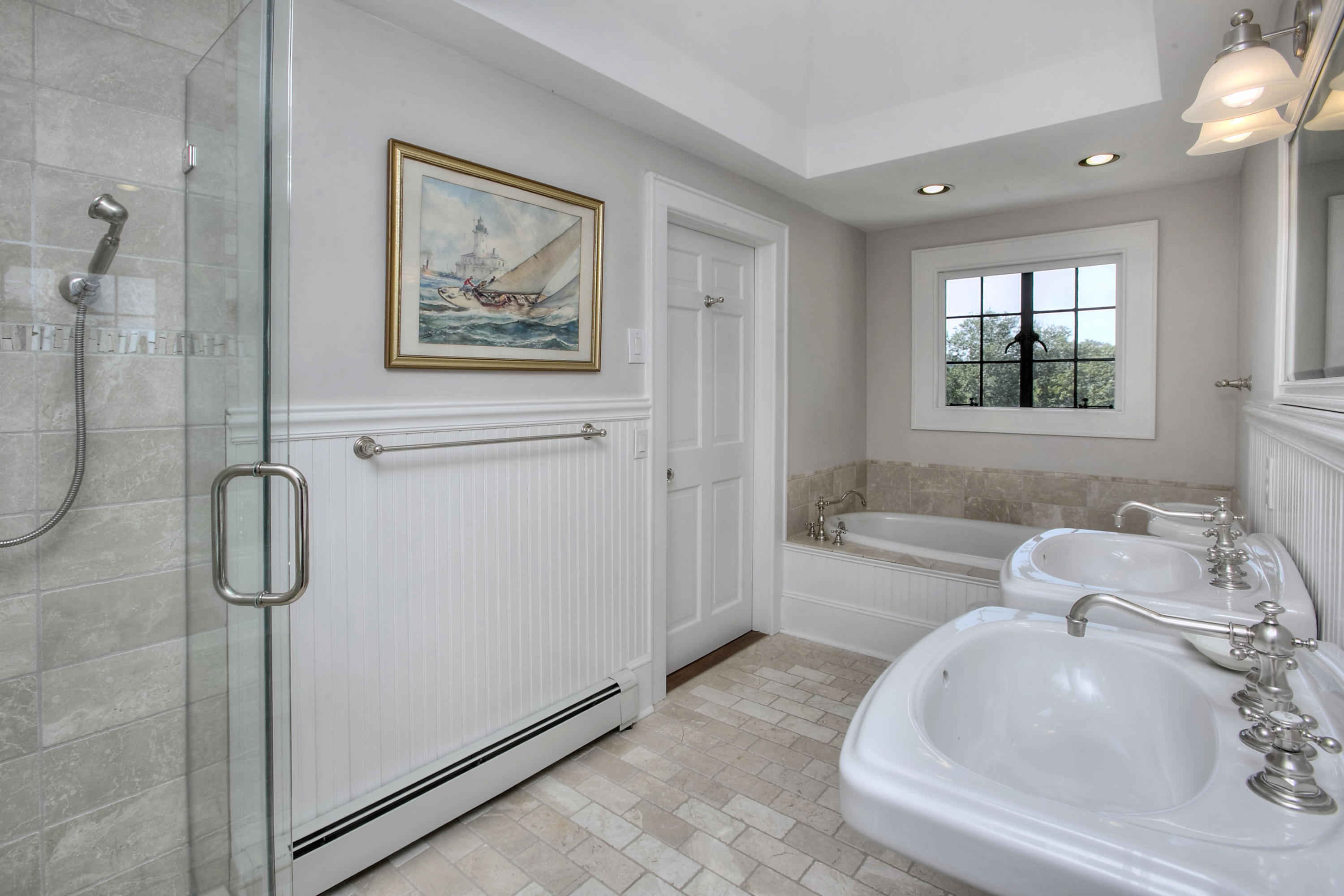 9 Sunswyck Road Darien, CT 06820 - Photo 29 of 43 a bathroom with a tub sink and mirror