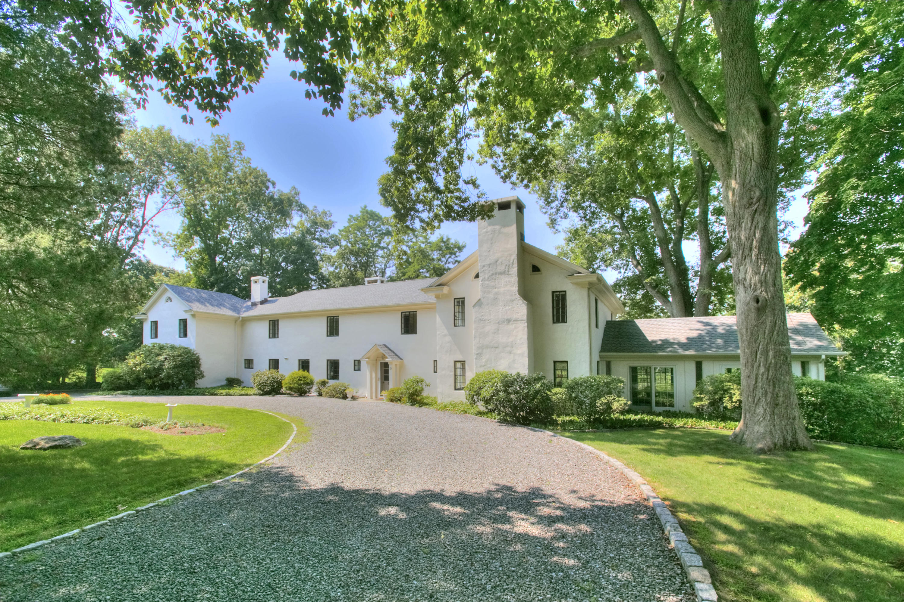 9 Sunswyck Road Darien, CT 06820 - Photo 3 of 43 a front view of a house with garden