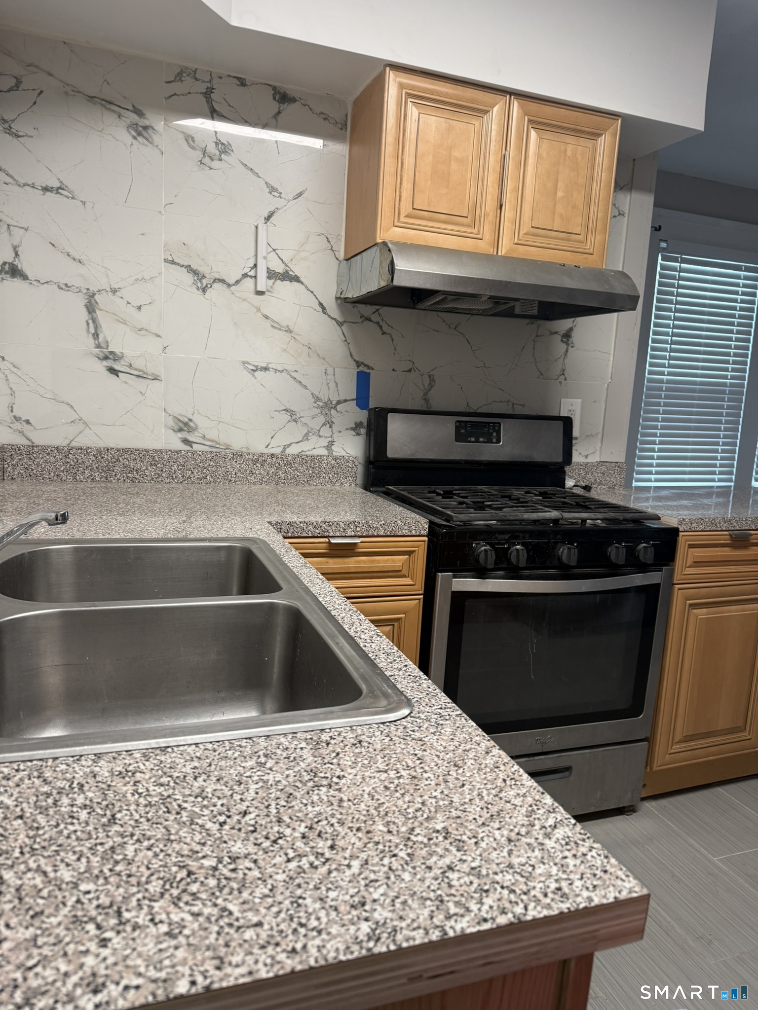 158 Alder Street, Unit 3 Waterbury, CT 06708 - Photo 14 of 19 a kitchen with granite countertop a stove and a sink