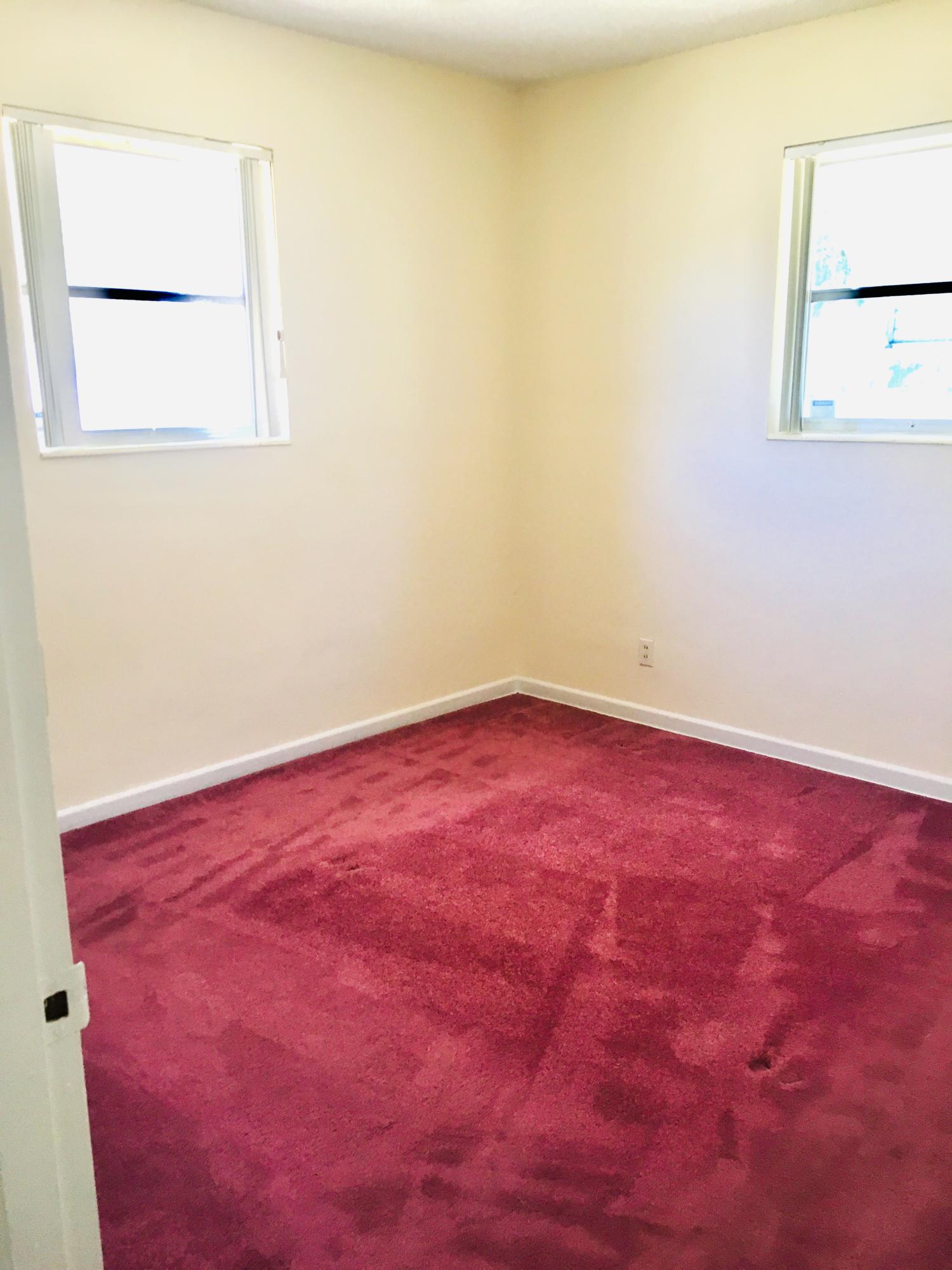 321 Winged Foot Road Palm Springs, FL 33461 - Photo 14 of 30 an empty room with a window