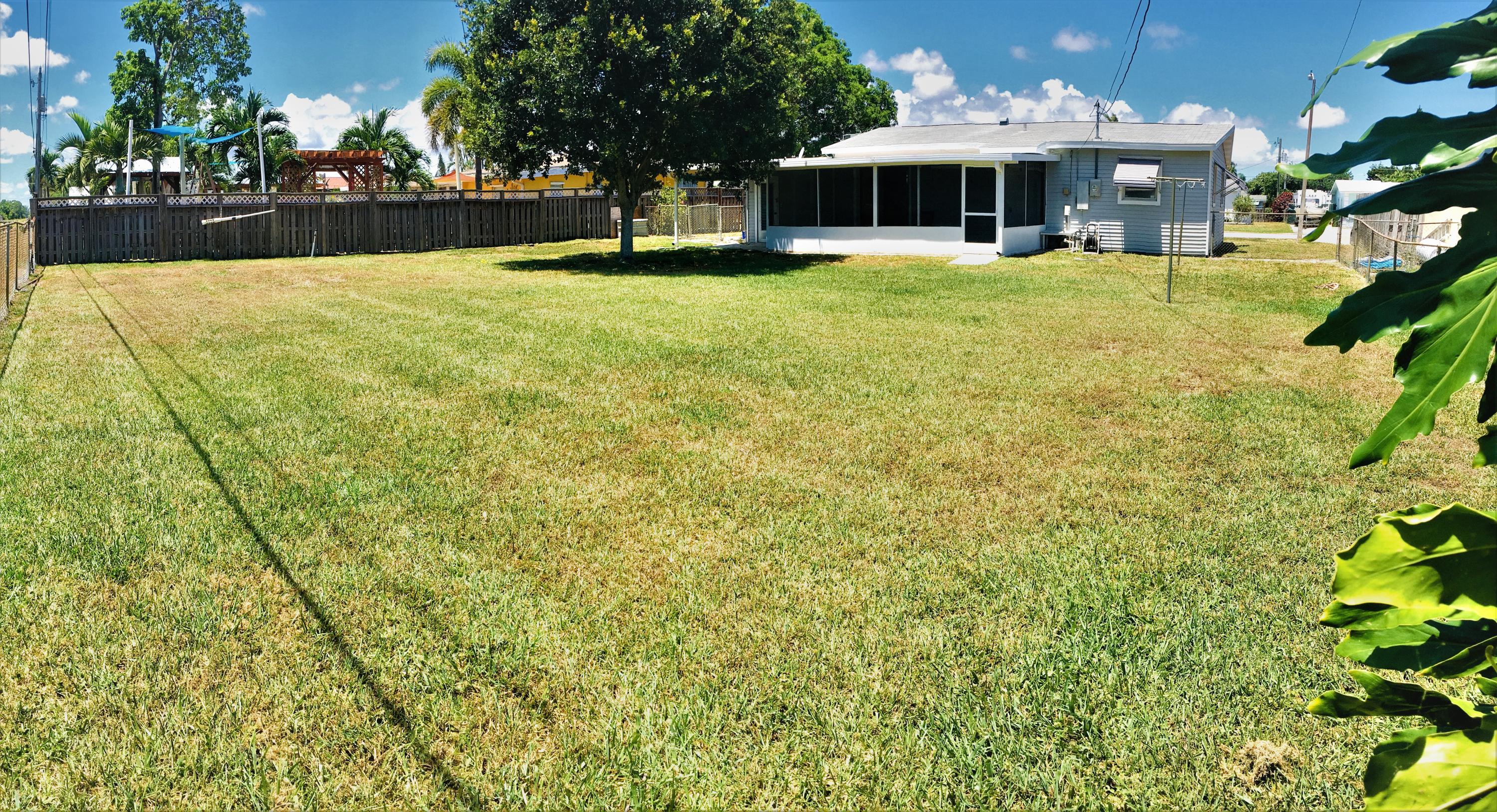 321 Winged Foot Road Palm Springs, FL 33461 - Photo 10 of 30 a front view of a house with a yard