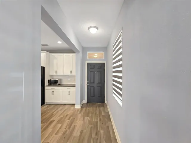 a large kitchen with a refrigerator oven a sink and dishwasher
