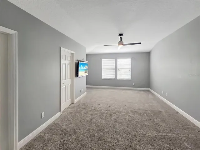a bathroom with a sink double vanity granite and a shower