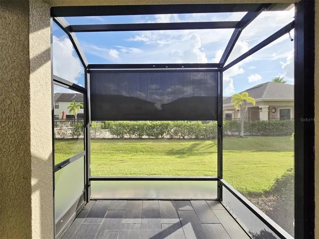 a front view of a house with lots of trees