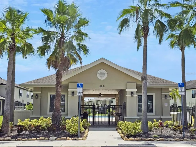 a view of house with swimming pool outdoor seating