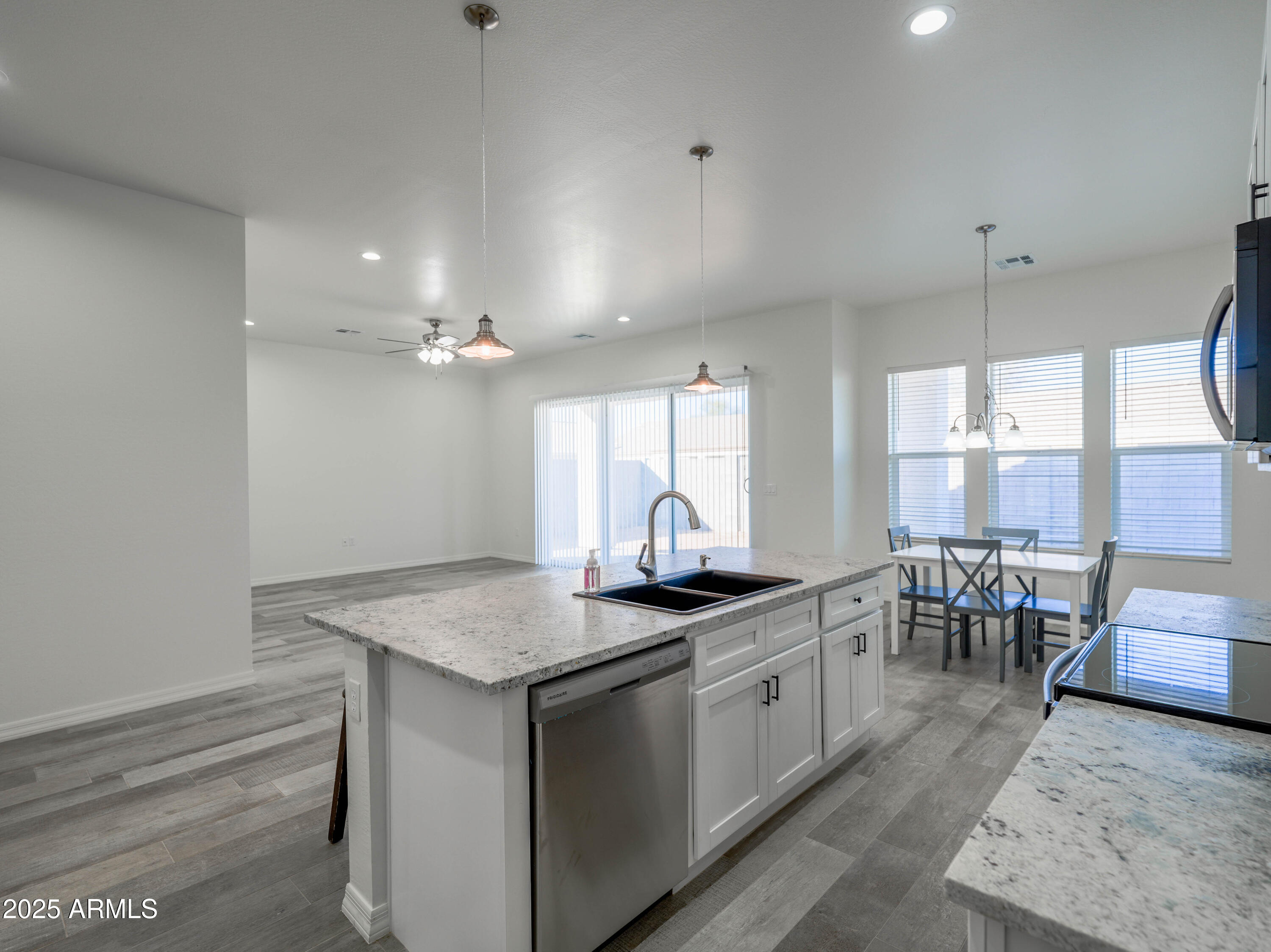 14554 South Diablo Road Arizona City, AZ 85123 - Photo 11 of 33 a kitchen with a counter space a sink cabinets and appliances
