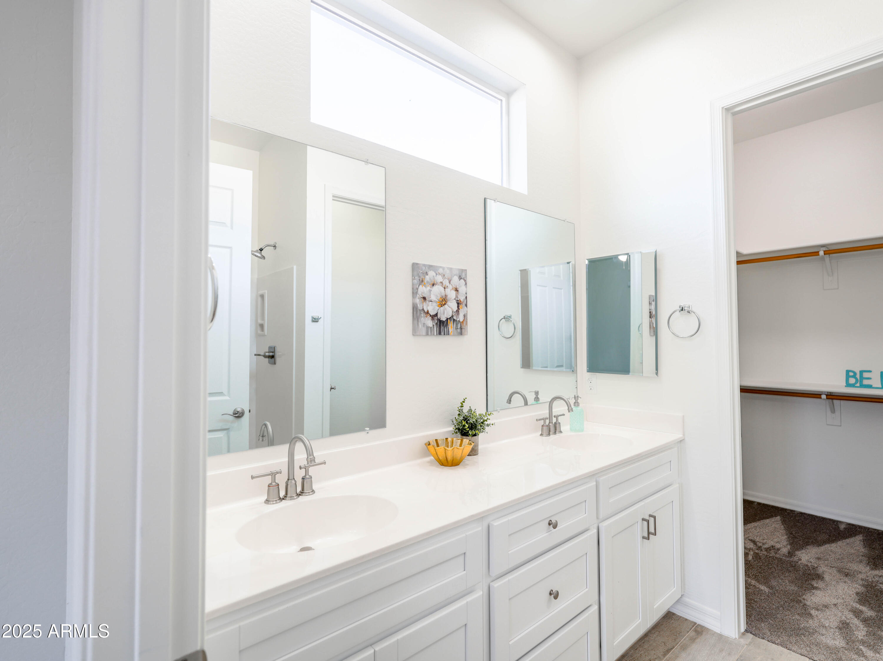14554 South Diablo Road Arizona City, AZ 85123 - Photo 16 of 33 a bathroom with double vanity sinks a mirror and a shower