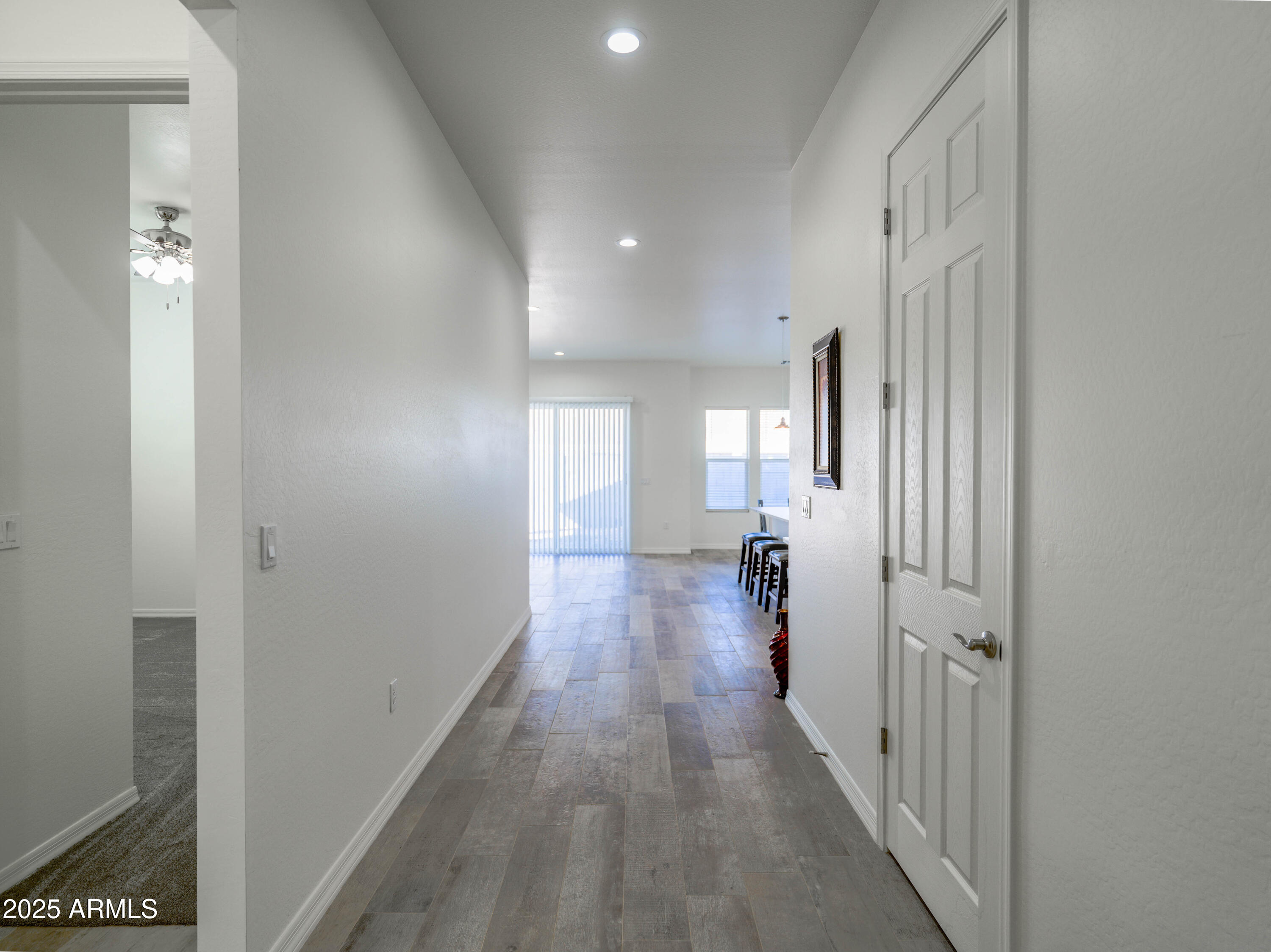 14554 South Diablo Road Arizona City, AZ 85123 - Photo 2 of 33 a view of a hallway with wooden floor and closet