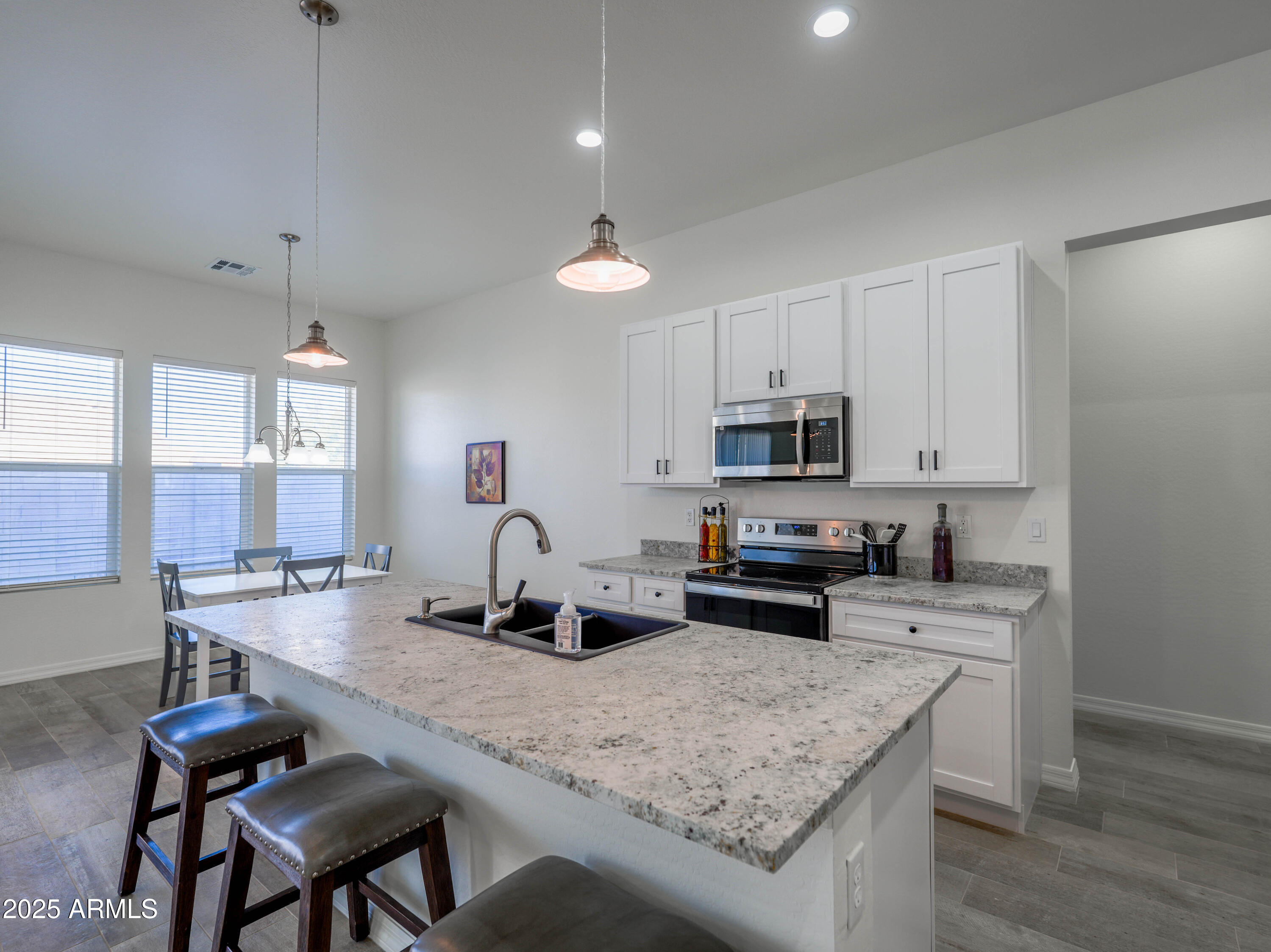 14554 South Diablo Road Arizona City, AZ 85123 - Photo 5 of 33 a kitchen with stainless steel appliances granite countertop a sink stove and refrigerator