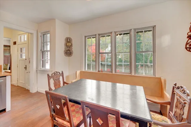 a kitchen that has a table and chairs in it