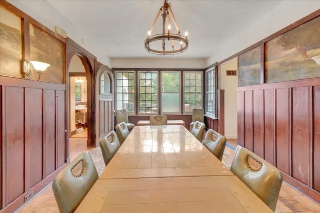 a bathroom with a sink a toilet and a window