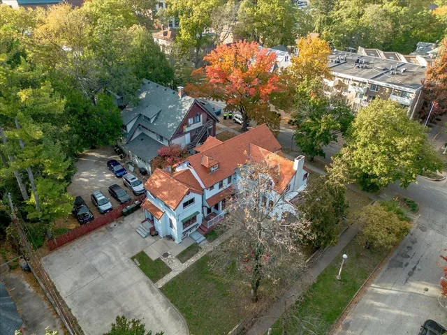 an aerial view of a house with a yard