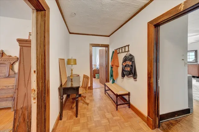 a living room with furniture a rug and a chandelier