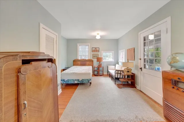 an aerial view of a house with garden space and street view