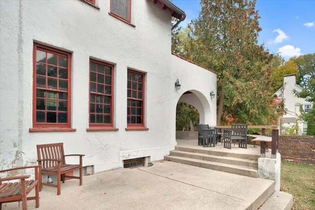 a very nice looking room with a fireplace and windows