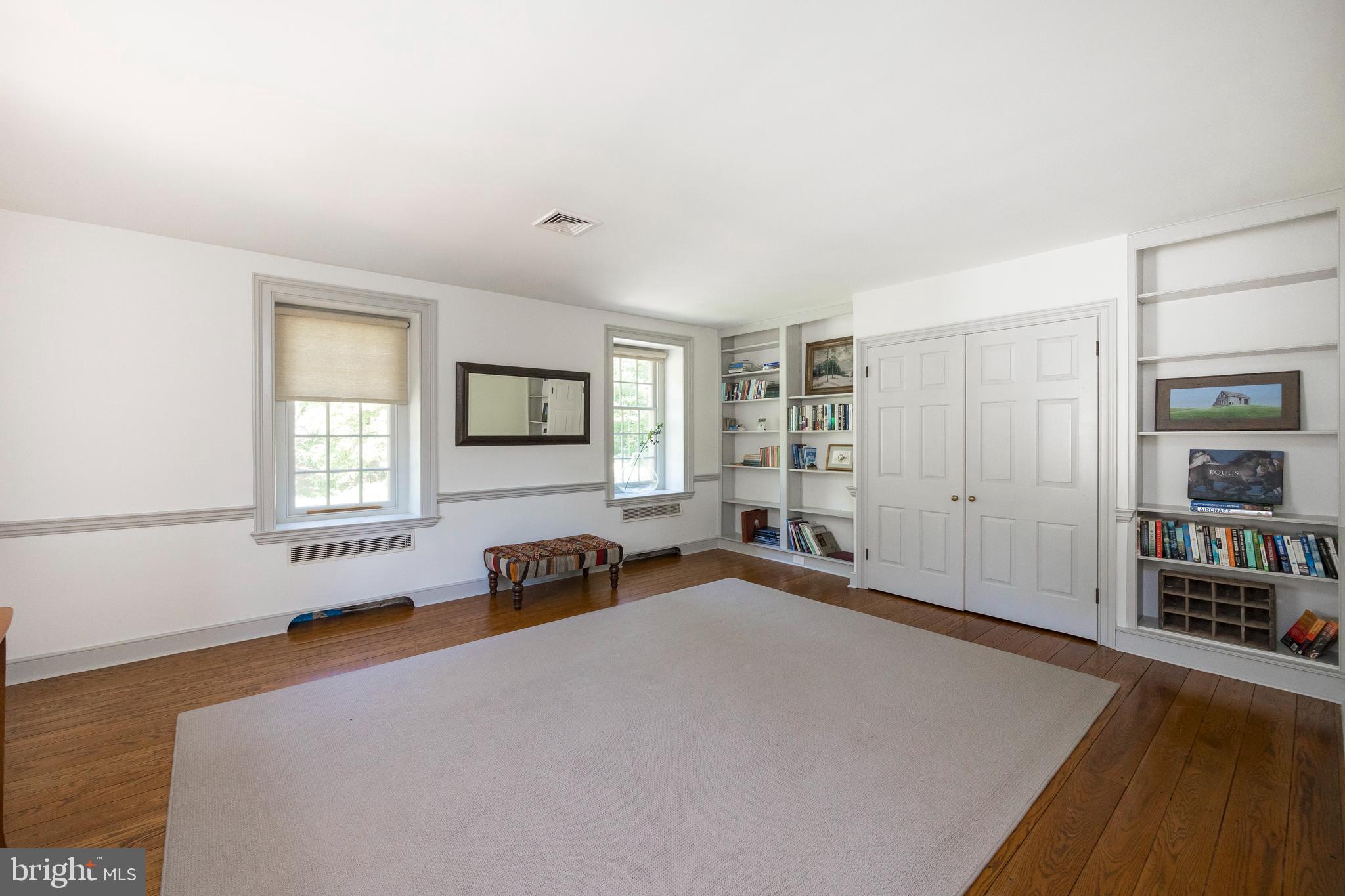 1351 Warwick Furnace Road Pottstown, PA 19465 - Photo 34 of 76 Bedroom 2 with wall of custom shelving and closet