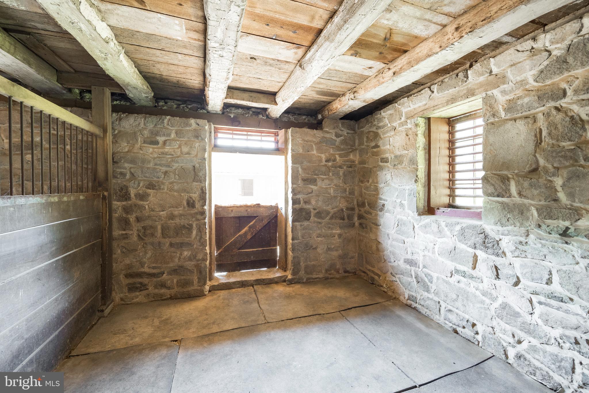 1351 Warwick Furnace Road Pottstown, PA 19465 - Photo 75 of 76 Stone walled horse stall in lower barn area