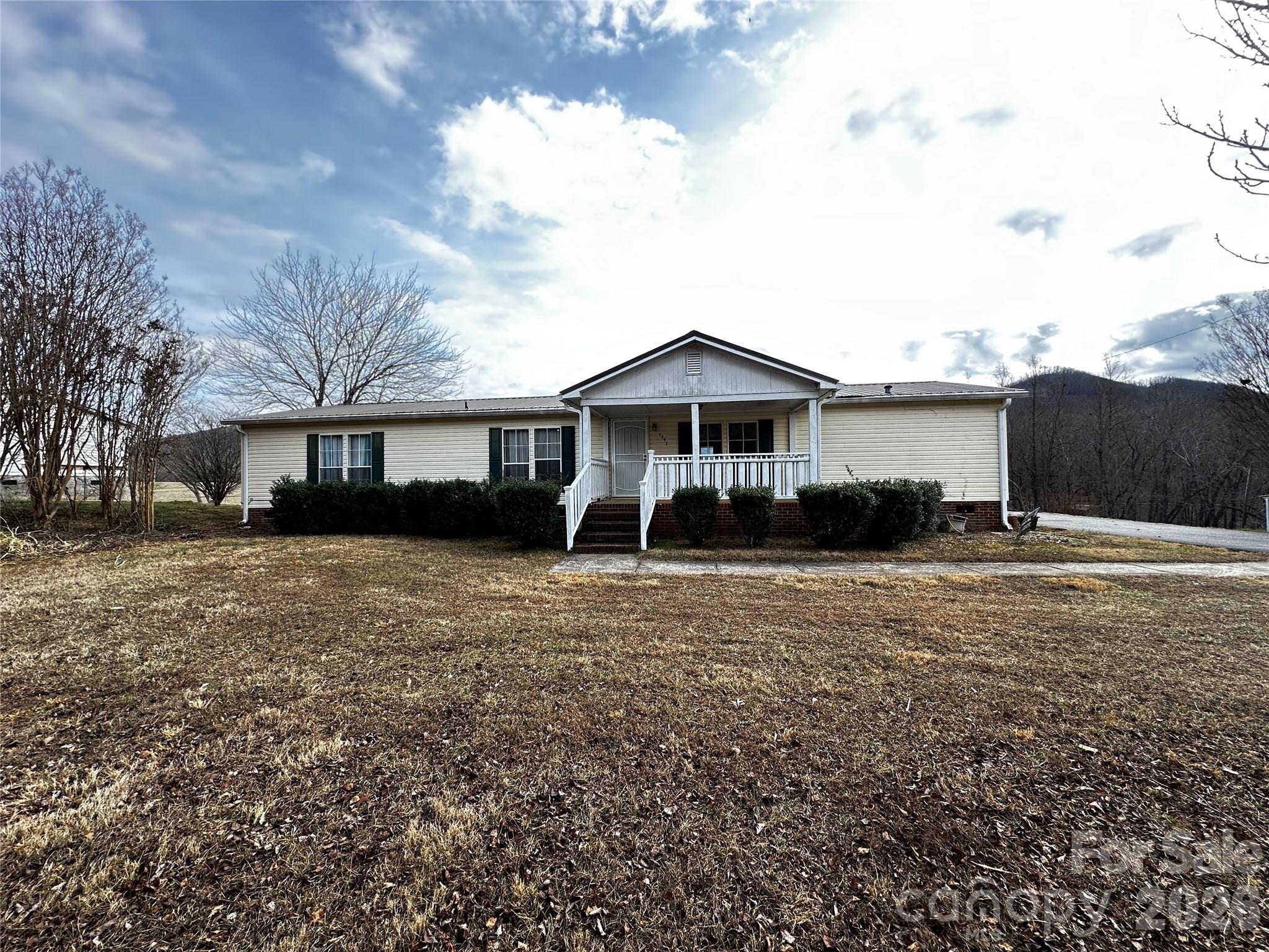 7447 Highway 64, Unit 2 Morganton, NC 28655 - Photo 2 of 27 a front view of a house with a yard