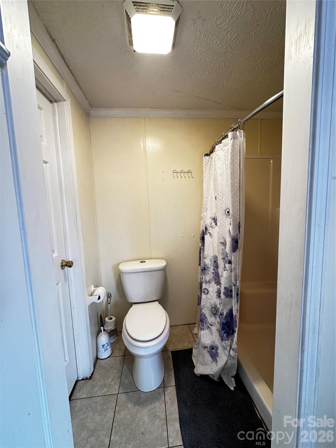 7447 Highway 64, Unit 2 Morganton, NC 28655 - Photo 24 of 27 a bathroom with a toilet and a shower