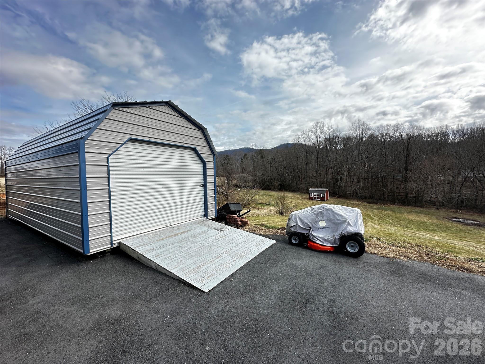 7447 Highway 64, Unit 2 Morganton, NC 28655 - Photo 4 of 27 a car parked in front of a house