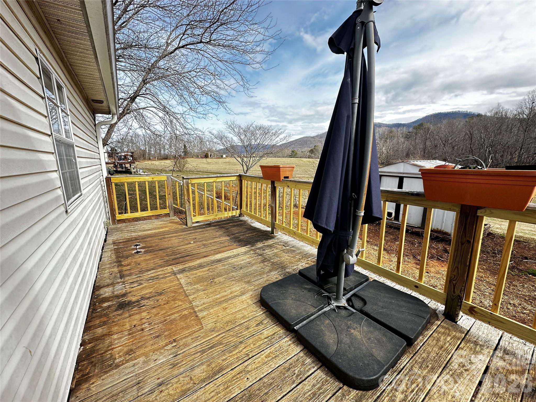 7447 Highway 64, Unit 2 Morganton, NC 28655 - Photo 7 of 27 a view of balcony with hardwood floor and city view
