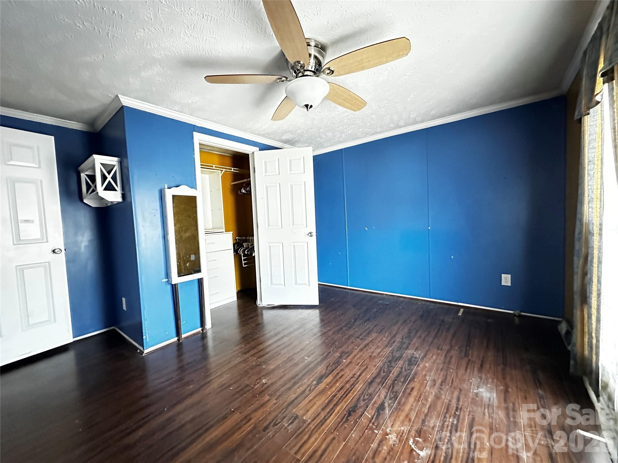 7447 Highway 64, Unit 2 Morganton, NC 28655 - Photo 9 of 27 an empty room with wooden floor and windows