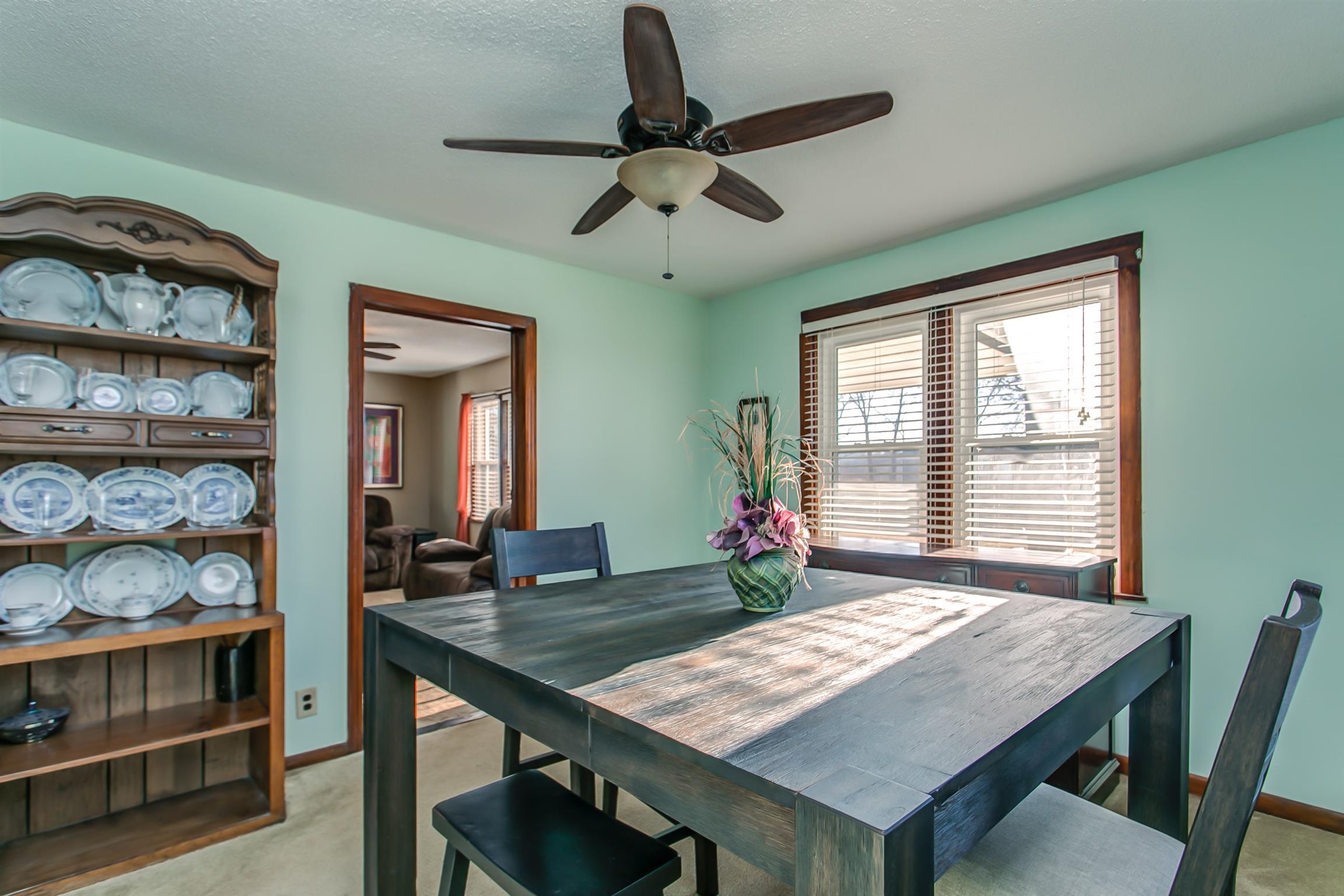 4227 Kedron Road Spring Hill, TN 37174 - Photo 6 of 13 a view of a dining room with furniture window and wooden floor