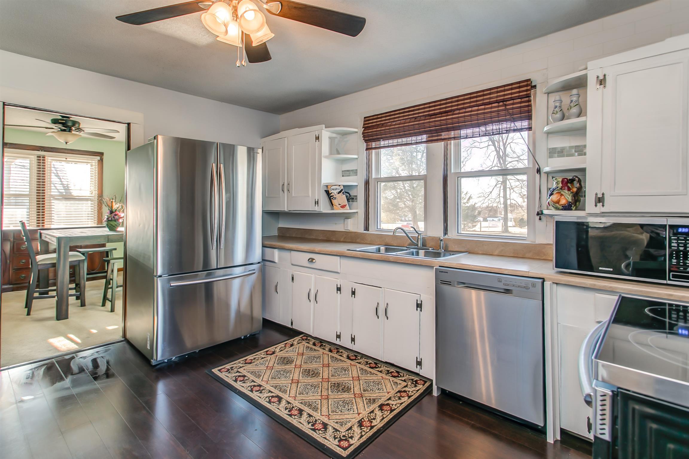 4227 Kedron Road Spring Hill, TN 37174 - Photo 10 of 13 a kitchen with a refrigerator a sink and a stove