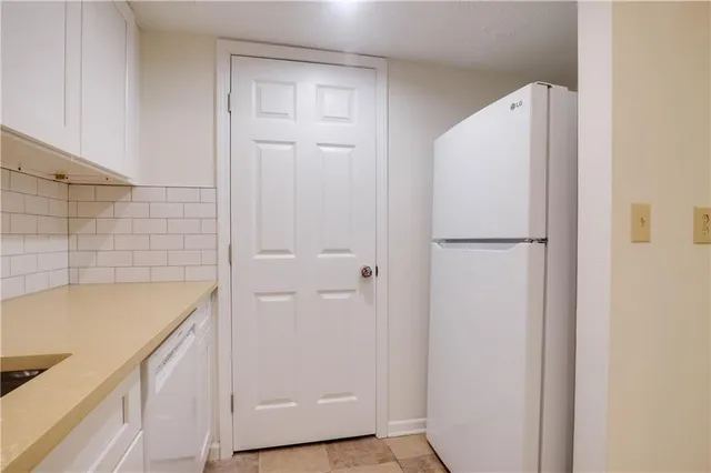 a bathroom with a shower and a sink
