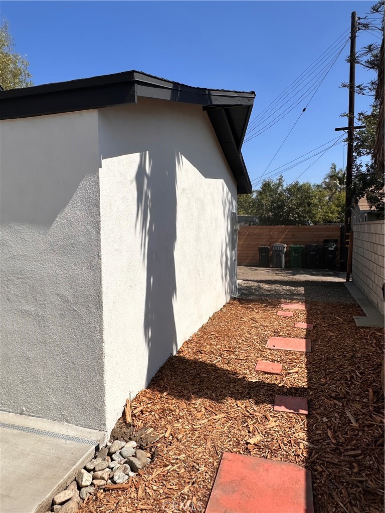 14621 1/2 Clark Street Baldwin Park, CA 91706 - Photo 21 of 28 a front view of a house with a yard