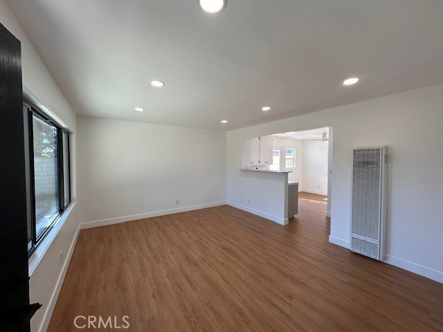 14621 1/2 Clark Street Baldwin Park, CA 91706 - Photo 4 of 28 a view of empty room with wooden floor and fan