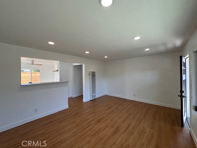 14621 1/2 Clark Street Baldwin Park, CA 91706 - Photo 7 of 28 an empty room with wooden floor and windows