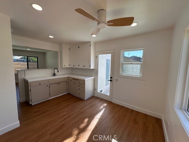 14621 1/2 Clark Street Baldwin Park, CA 91706 - Photo 9 of 28 a kitchen with a sink cabinets and wooden floor