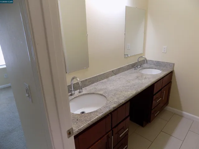 a white toilet sitting next to a shower