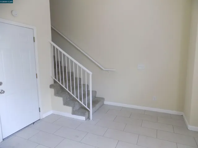 a view of entryway with stairs