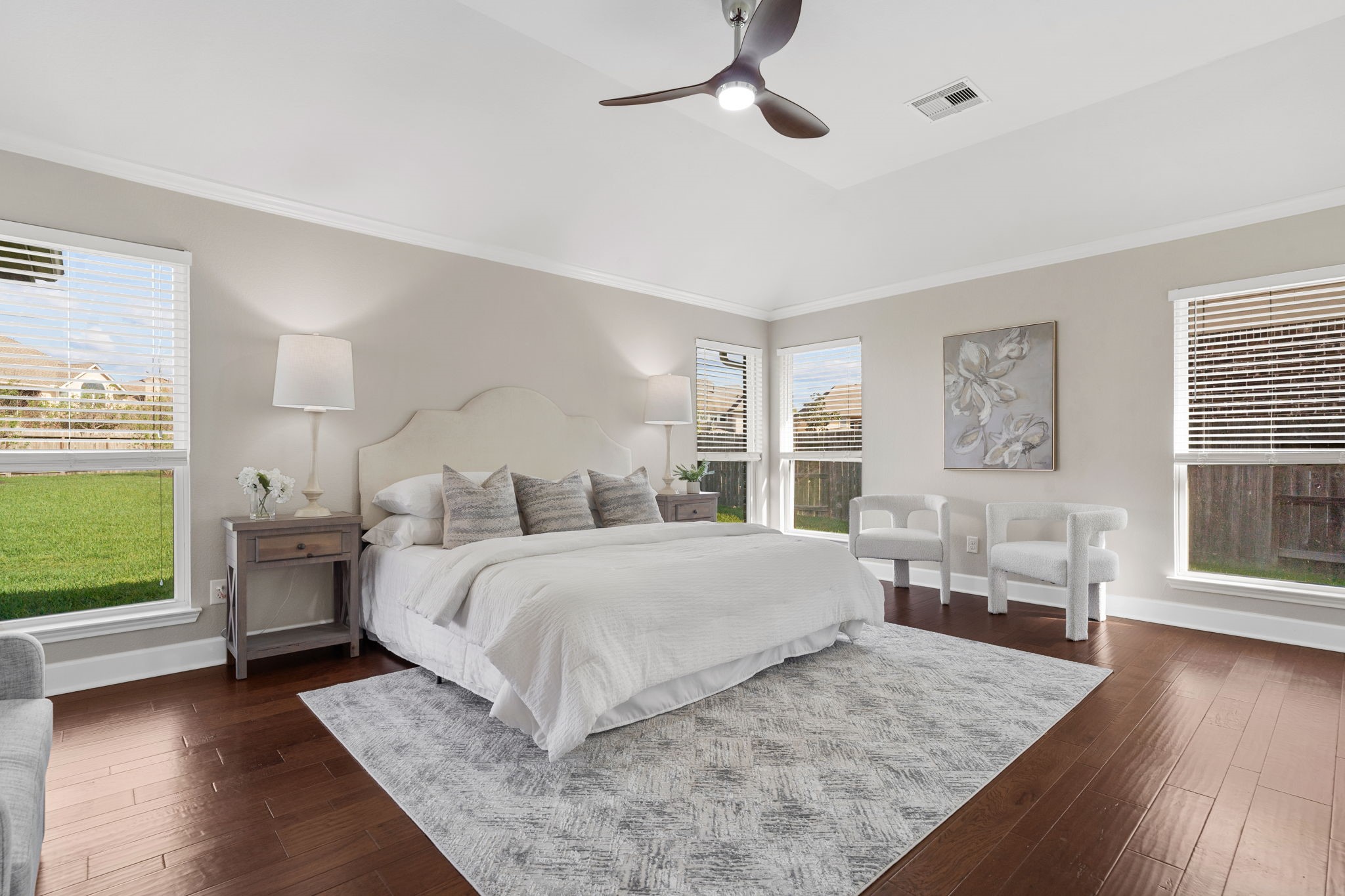 3426 Summer Ranch Drive Katy, TX 77494 - Photo 20 of 48 The primary suite offers a peaceful retreat with rich flooring, soft neutral tones, and generous space for a full bedroom set, creating a relaxing place to begin and end each day.